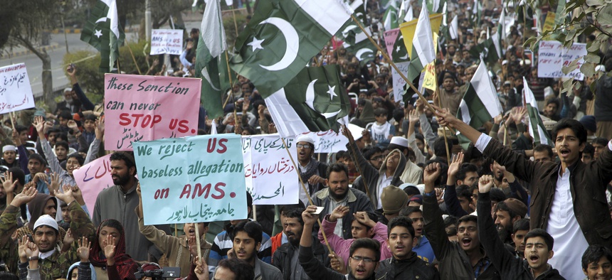 Supporters of Pakistani religious parties chant anti-American slogans during a rally in Lahore, Pakistan, Sunday, Jan. 8, 2017.