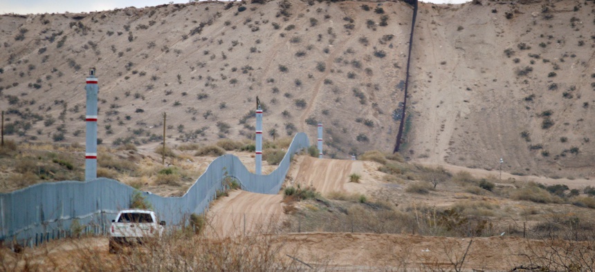 A U.S. Border Patrol agent drives near the U.S.-Mexico border fence in Sunland Park, N.M. in 2016.