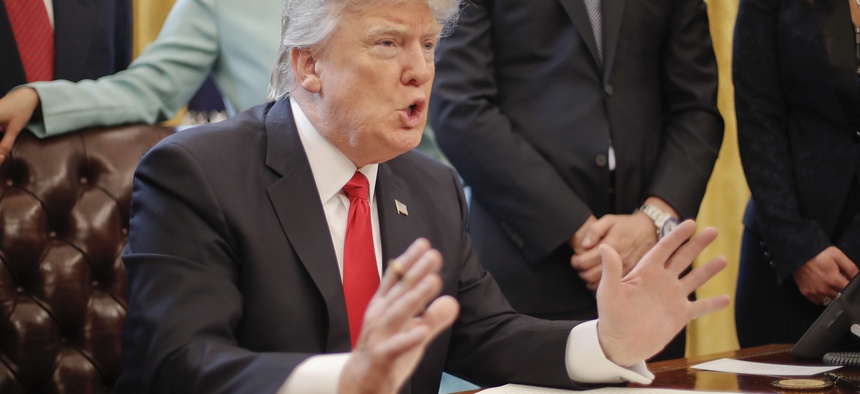President Donald Trump speaks in the Oval Office of the White House in Washington, Monday, Jan. 30, 2017.