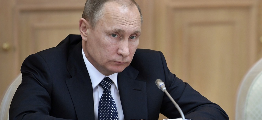 Russian President Vladimir Putin listens during a meeting of the council of trustees of the Moscow State University (MGU) in Moscow on Wednesday, Jan. 25, 2017.