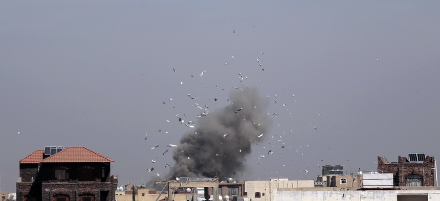 Debris and smoke rise after a Saudi-led airstrike hit an army base, in Sanaa, Yemen, on Jan. 22, 2017.