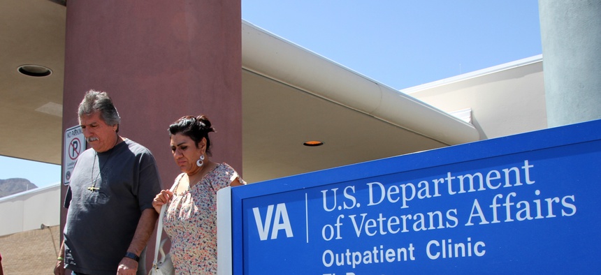 Patients exit the Vetarans Affairs facility in El Paso, Texas, June 9, 2014.