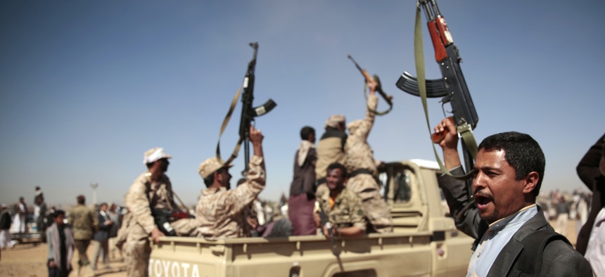 A tribesman loyal to Houthi rebels, right, chants slogans during a gathering aimed at mobilizing more fighters into battlefronts to fight pro-government forces in several Yemeni cities, in Sanaa, Yemen, Tuesday, Jan. 3, 2017.