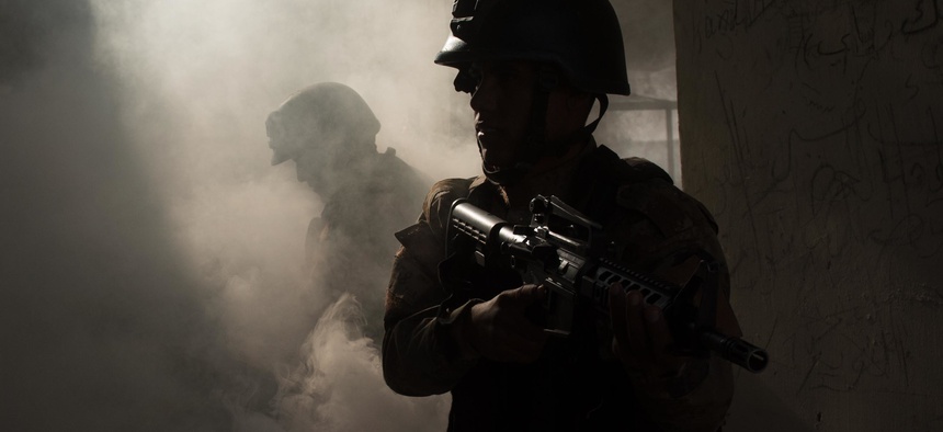 Iraqi Counter-Terrorism Service soldiers coordinate to tactically enter and clear rooms during an urban operation terrain exercise near Baghdad, Iraq, Nov. 27, 2016.