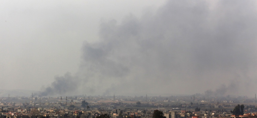 Smoke rises from the western side of Mosul following a U.S.-led coalition airstrike, in Mosul, Iraq, Monday, Jan. 30, 2017.