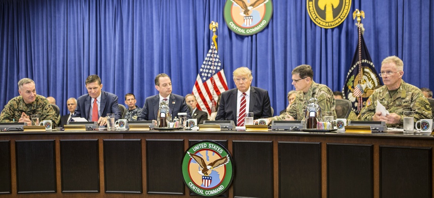 President Donald Trump with Marine Gen. Joseph F. Dunford Jr., Joint Chiefs chairman; Army Gen. Joseph Votel, CentCom commander; and Gen. Raymond A. "Tony" Thomas, SOCOM commander; at USCENTCOM headquarters on MacDill Air Force Base Feb. 6, 2017.
