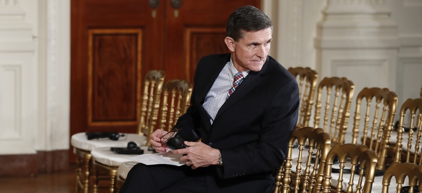 National Security Adviser Michael Flynn sits in the front row before the start of the President Donald Trump and Japanese Prime Minister Shinzo Abe joint new conference in the East Room of the White House, in Washington, Friday, Feb. 10, 2017.