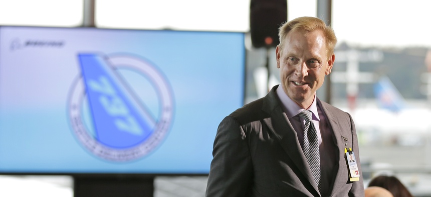 Pat Shanahan, then-senior vice president of Airplane Programs for Boeing Commercial Airplanes, greets guests at a re-opening ceremony for Boeing's newly expanded 737 delivery center in Seattle in 2015.