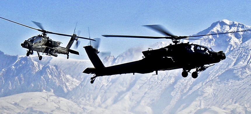 Two Boeing AH-64D Apache helicopters from the 1st Air Cavalry Brigade, 1st Cavalry Division.