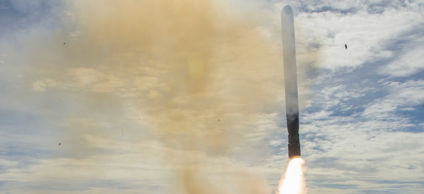 The Arleigh Burke class guided missile destroyer USS Mustin (DDG 89) fires a Tomahawk Land Attack Missile during a 2014 exercise.