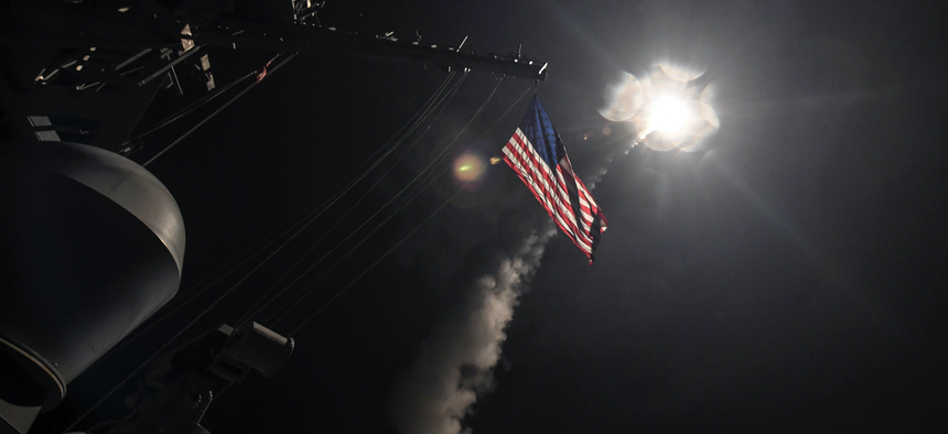 In this image provided by the U.S. Navy, the guided-missile destroyer USS Porter (DDG 78) launches a tomahawk land attack missile in the Mediterranean Sea, Friday, April 7, 2017.