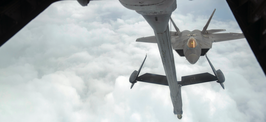 A U.S. Air Force F-22 Raptor approaches a U.S. Air Force KC-10 Extender from the 908th Expeditionary Air Refueling Squadron before aerial refueling during a Combined Joint Task Force - Operation Inherent Resolve mission Feb. 12, 2017.