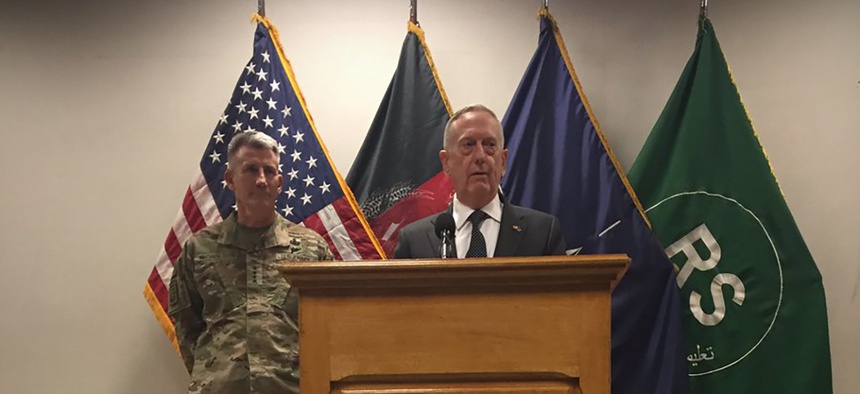 Defense Secretary Jim Mattis speaks to reporters from Resolute Support headquarters in Kabul, Afghanistan, as Gen. John Nicholson stands behind Mattis on April 24, 2017.