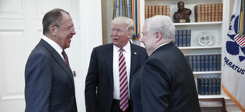 U.S. President Donald Trump meets with Russian Foreign Minister Sergey Lavrov, left, next to Russian Ambassador to the U.S. Sergei Kislyak at the White House in Washington, Wednesday, May 10, 2017.