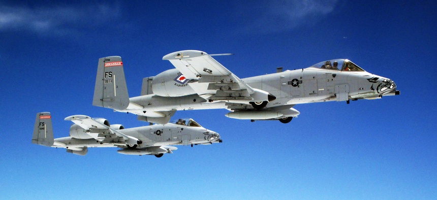 A pair of Air Force A-10 Warthogs fly in formation.