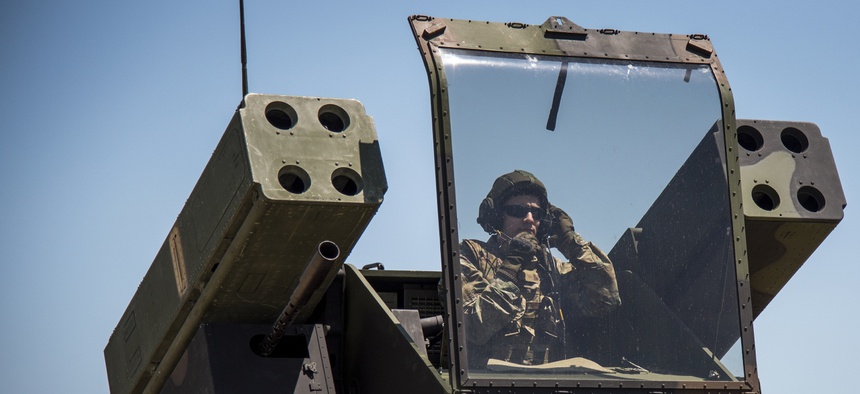 A soldier prepares to fire a Stinger missile from an Avenger vehicle at Eglin Air Force Base in Florida.