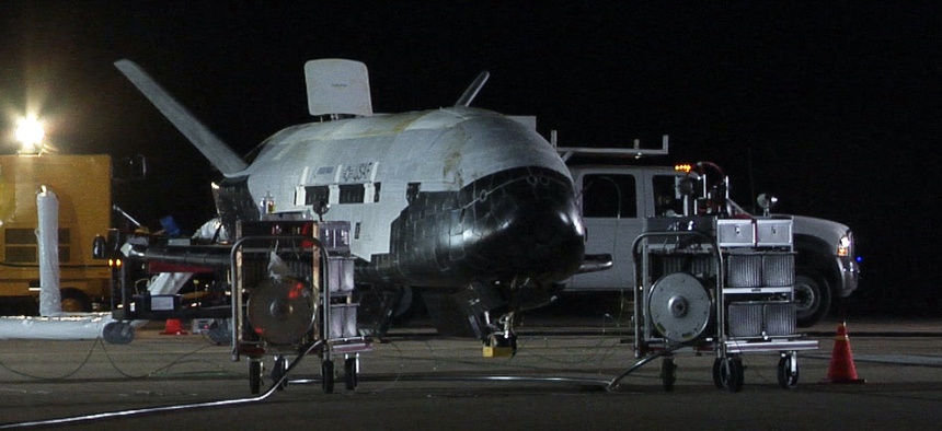 The U.S. Air Force X-37B, named Orbital Test Vehicle 1 (OTV-1), sits on the Vandenberg Air Force Base, Calif., runway during post-landing operations Dec. 3, 2010.