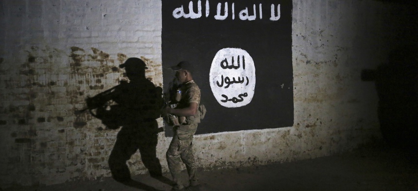 An Iraqi soldier inspects a discovered ISIS train tunnel, Mar. 1, 2017.