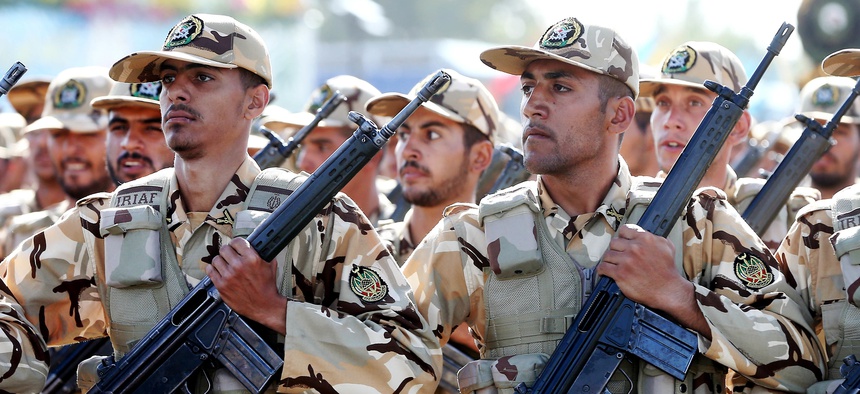 Iranian armed forces members march in a military parade marking the 36th anniversary of Iraq's 1980 invasion of Iran, in front of the shrine of late revolutionary founder Ayatollah Khomeini, just outside Tehran, Iran, Wednesday, Sept. 21, 2016.