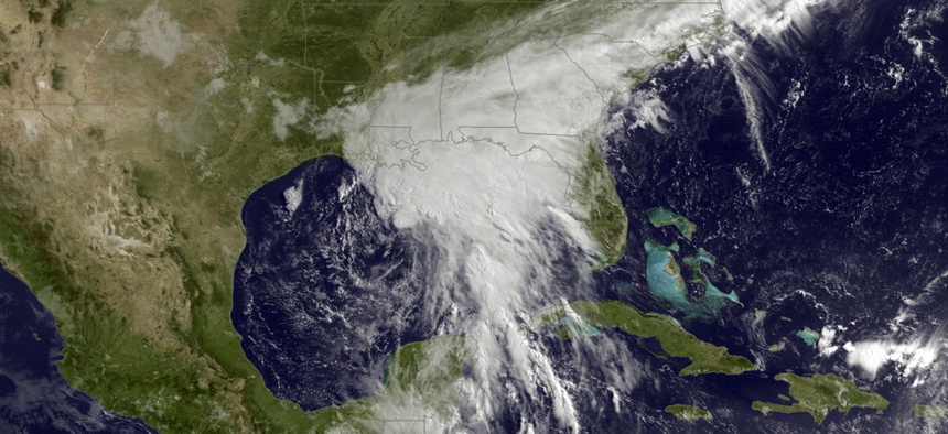 This satellite image taken Tuesday, June 20, 2017, and released by the National Oceanic and Atmospheric Administration shows a tropical storm over the Gulf of Mexico approaching the Gulf Coast.