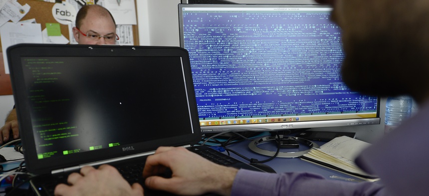 n this picture taken on March 5, 2015, employees work at the headquarters of Bitdefender, a leading Romanian cyber security company, in Bucharest, Romania. Romania, the eastern European country, known more for economic disarray than technological prowess.