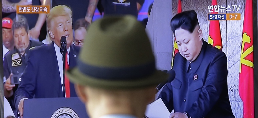A TV screen shows images of the U.S. President Donald Trump, left, and North Korean leader Kim Jong Un during a news program at the Seoul Railway Station in Seoul, South Korea, May 2, 2017.