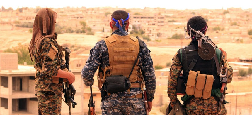 Syrian Democratic Forces looking toward the northern town of Tabqa, Syria. Photo provided Sun., Apr. 30, 2017.