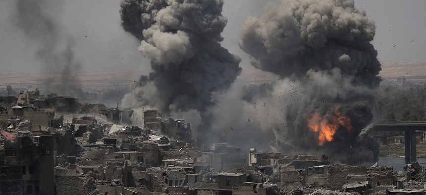 Airstrikes target Islamic State positions on the edge of the Old City a day after Iraq's prime minister declared "total victory" in Mosul, Iraq, Tuesday, July 11, 2017
