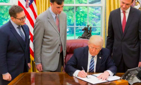 President Donald Trump signs a May 11, 2017, order on cybersecurity. President Donald Trump signs a May 11, 2017, order on cybersecurity.