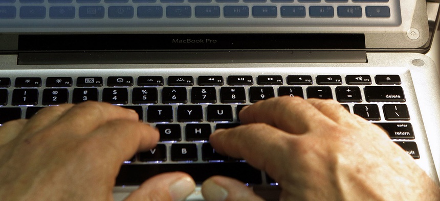 In this Feb. 27, 2013, file photo illustration, hands type on a computer keyboard in Los Angeles.