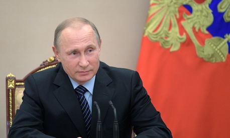 Russian President Vladimir Putin chairs a Security Council meeting in Moscow, Russia, Friday, June 16, 2017. The meeting was focused on the Russian military's claim that it had killed the Islamic State group's leader in a Russian President Vladimir Putin chairs a Security Council meeting in Moscow, Russia, Friday, June 16, 2017. The meeting was focused on the Russian military's claim that it had killed the Islamic State group's leader in a