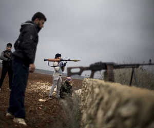 Free Syrian Army fighters take their positions, close to a military base, near Azaz, Syria, Dec. 10, 2012. Free Syrian Army fighters take their positions, close to a military base, near Azaz, Syria, Dec. 10, 2012.