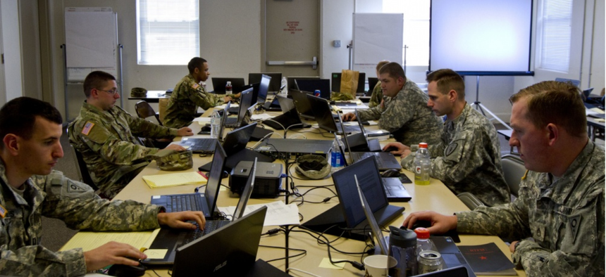 A group of U.S. Army Reserve and National Guard cyber Soldiers work together to defend their network during Cyber Shield 17 at Camp Williams, Utah, May 2, 2017.