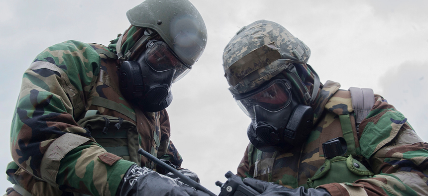 KADENA AIR BASE, Japan (Feb. 9, 2017) - U.S. Air Force Senior Airman Adam Reams and Airman 1st Class Daniel Paolucci, 18th Communications Squadron client systems technicians, conduct a post-attack reconnaissance stand check during Exercise Green Dragon at