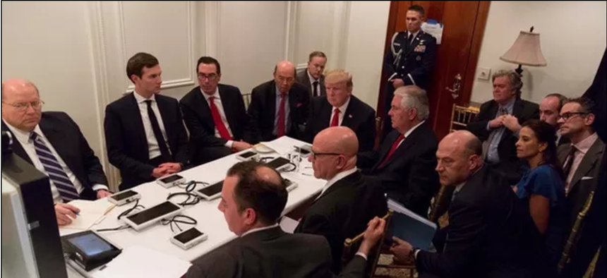 Donald Trump is shown in an official White House handout image meeting with his National Security team.