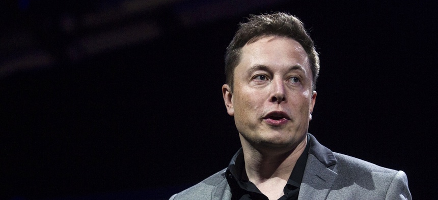 In this April 30, 2015, file photo, Tesla Motors CEO Elon Musk unveils the company's newest products, in Hawthorne, Calif.