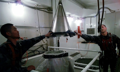 U.S. Airmen mount a refurbished nuclear warhead on to the top of a Minuteman III intercontinental ballistic missile inside an underground silo in Scottsbluff, Neb., April 15, 1997. U.S. Airmen mount a refurbished nuclear warhead on to the top of a Minuteman III intercontinental ballistic missile inside an underground silo in Scottsbluff, Neb., April 15, 1997.