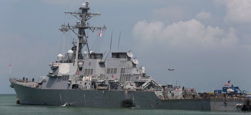 The Guided-missile destroyer USS John S. McCain (DDG 56) is moored pier side at Changi naval base in Singapore following a collision with the merchant vessel Alnic MC Monday, Aug. 21, 2017.