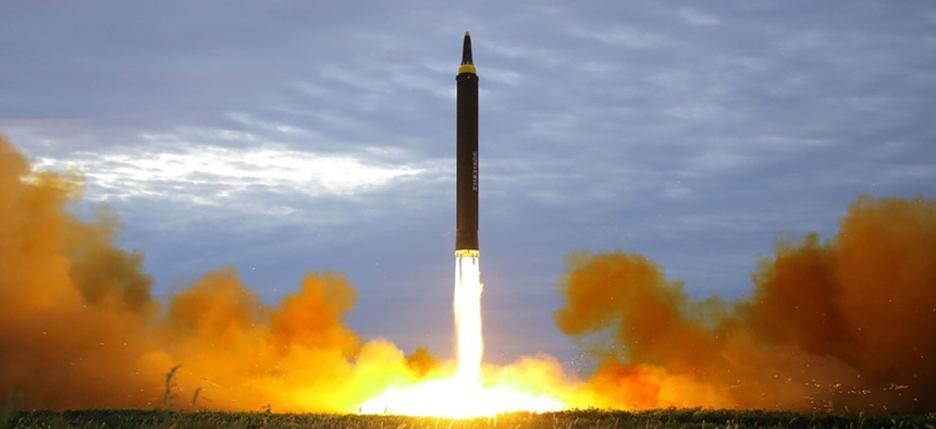 A missile is launched during a long and medium-range ballistic rocket launch drill in this photo released by North Korea's Korean Central News Agency in Pyongyang on August 30, 2017.