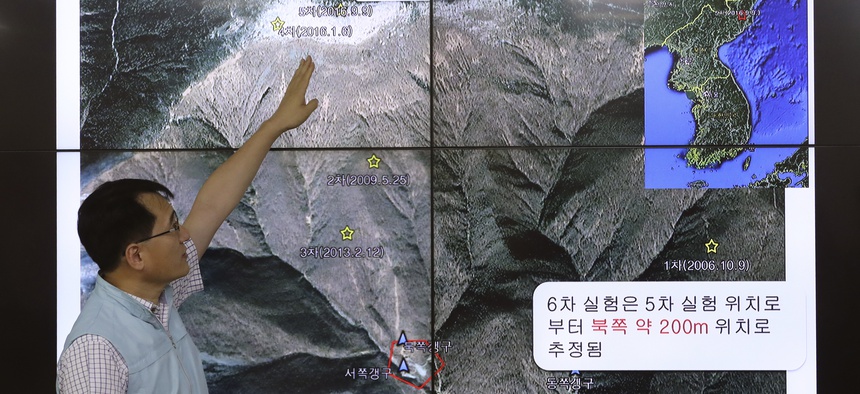 Earthquake and Volcano of the Korea Monitoring Division Director Ryoo Yong-gyu speaks in front of a screen showing about artificial earthquake in North Korea, in Seoul, South Korea, Sunday, Sept. 3, 2017.