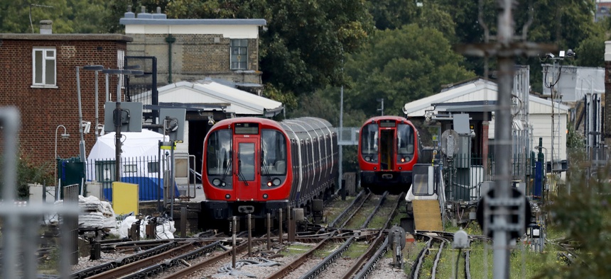 A police forensic tent stands setup on the platform next to the train, at left, on which a homemade bomb exploded at Parsons Green subway station in London, Friday, Sept. 15, 2017.