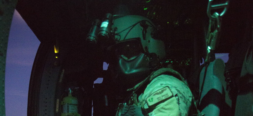 Master Sgt. Michael Berger, a special mission aviator from the 920th Rescue Wing, prepares for takeoff prior to a night flight on an HH-60G Pave Hawk helicopter July 6, 2017. The night exercise included a two-ship formation.