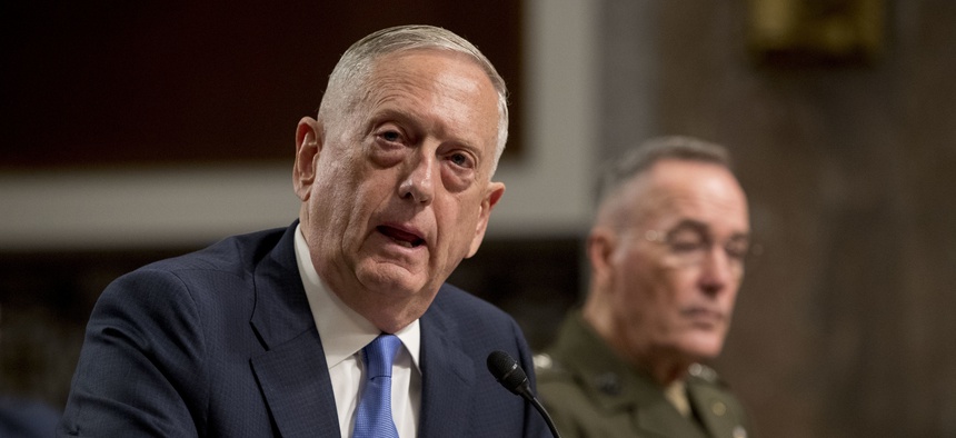 U.S. Defense Secretary Jim Mattis, left, accompanied by Joint Chiefs Chairman Gen. Joseph Dunford, speaks on Afghanistan before the Senate Armed Services Committee on Capitol Hill in Washington on Oct. 3, 2017.