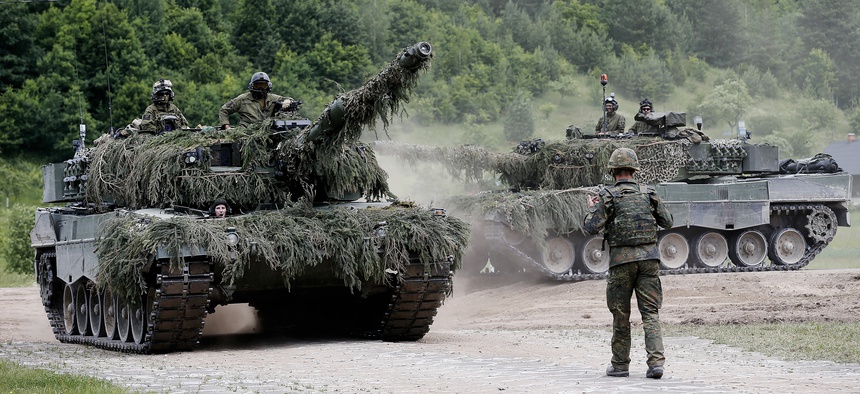 Two Leopard 2A4 tanks of Norway's armed forces take part in NATO's Enhanced Forward Presence in Lithuania in June 2017.