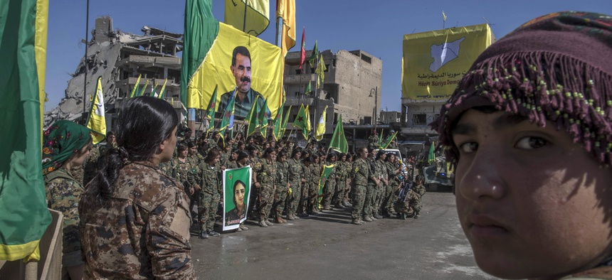 Fighters from the Women's Protection Units, or YPJ, say they will continue fighting for women. Here, they celebrate in Paradise Square, Raqqa, Syria, Thurs., Oct 19, 2017.