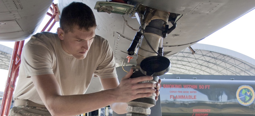 Senior Airman Jacob Prine checks the fuel connection to a F-15 Eagle in 2010.