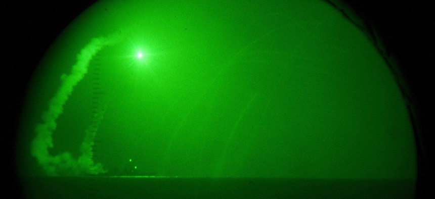 Guided missile destroyer USS Barry (DDG 52) fires Tomahawk cruise missiles in support of Operation Odyssey Dawn, March 19, 2011.