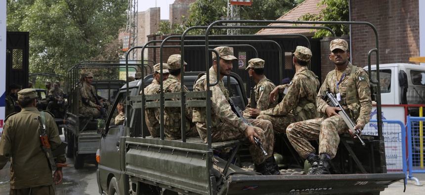 Pakistan army soldiers patrol near Gaddafi Stadium to ensure security ahead of the start of first Twenty20 cricket match between the World XI team and Pakistan, in Lahore, Pakistan, Tuesday, Sept. 12, 2017.