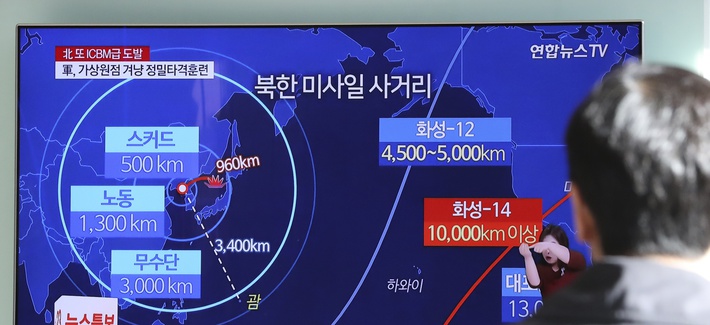 A man watches a TV screen showing a local news program reporting about North Korea's missile launch, at the Seoul Railway Station in Seoul, South Korea, Wednesday, Nov. 29, 2017.