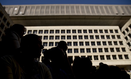 FBI employees listen as FBI Director Chris Wray speaks at his installation ceremony at the FBI Building earlier this fall. Wray has not publicly come to the agency's defense when Trump has criticized and delegitimized it. FBI employees listen as FBI Director Chris Wray speaks at his installation ceremony at the FBI Building earlier this fall. Wray has not publicly come to the agency's defense when Trump has criticized and delegitimized it.